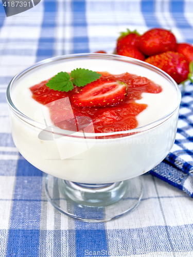 Image of Dessert milk with strawberry in bowl on towel