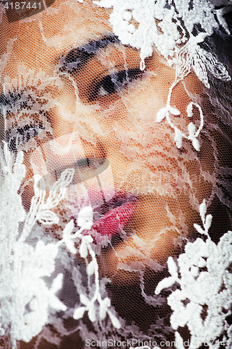 Image of portrait of beauty young afro woman through white lace, like new