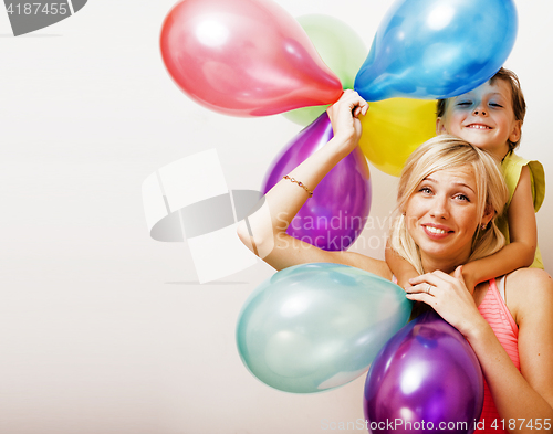 Image of pretty real family with color balloons on white background, blon