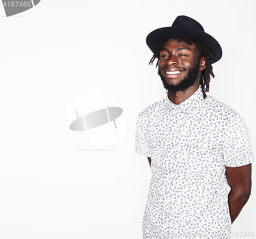 Image of young handsome afro american boy in stylish hipster hat gesturin