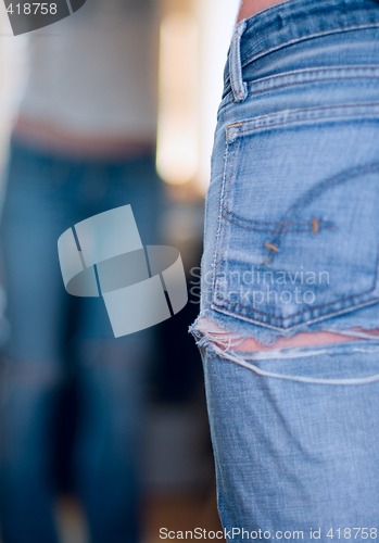 Image of girl in old jeans