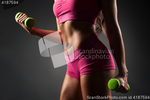 Image of Crop sportive female working out