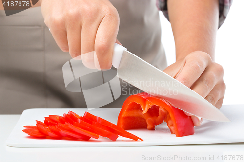 Image of Cook is chopping bell pepper