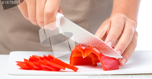 Image of Cook is chopping bell pepper