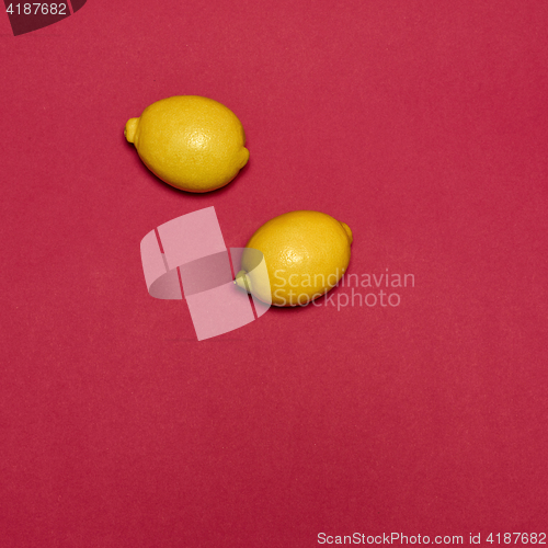 Image of Lemons on red background