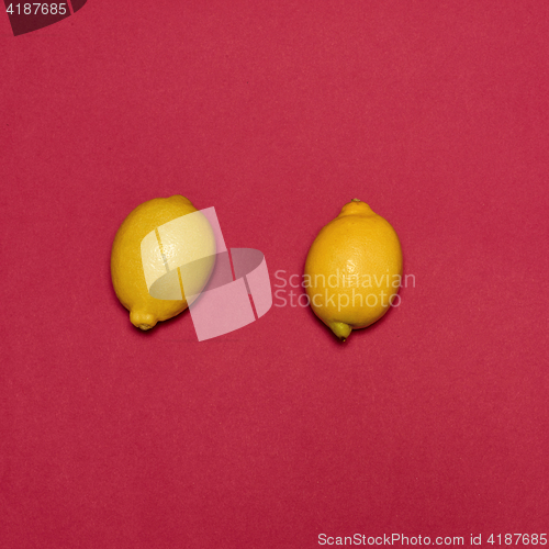 Image of Lemons on red background