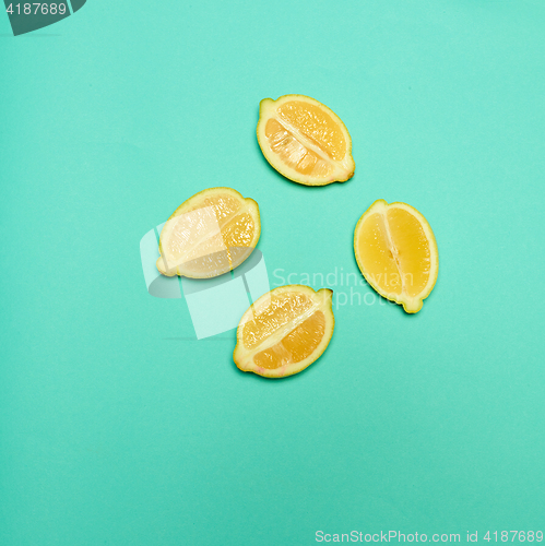 Image of Lemons on green background