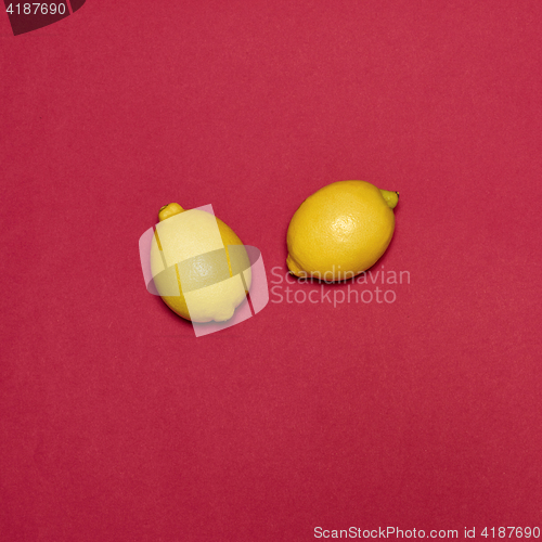 Image of Lemons on red background