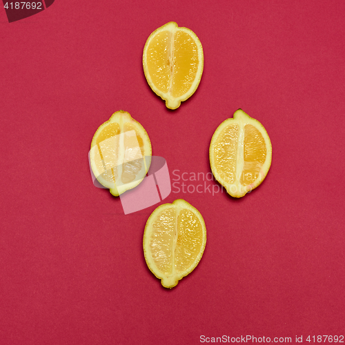 Image of Lemons on red background