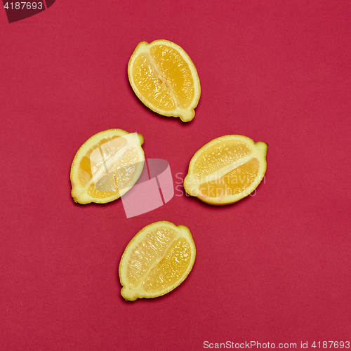 Image of Lemons on red background