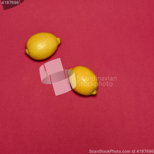 Image of Lemons on red background