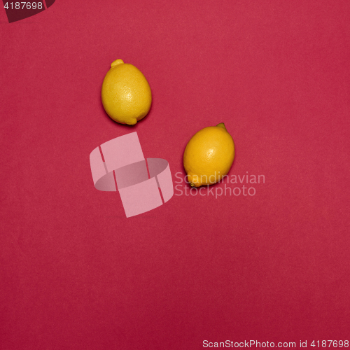 Image of Lemons on red background