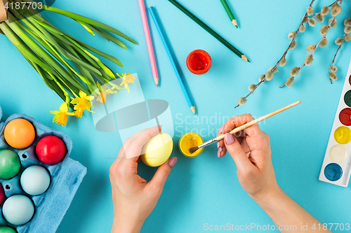 Image of The top view of easter on blue table office workplace