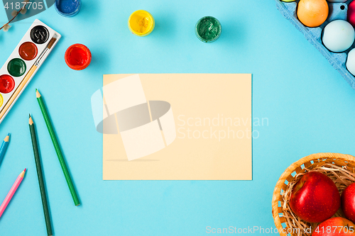 Image of The top view of easter on blue table office workplace