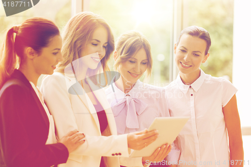 Image of business people with tablet pc computer at office