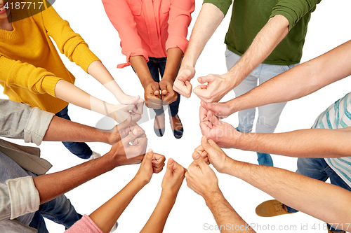 Image of hands of international people showing thumbs up