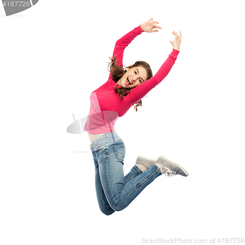 Image of happy young woman jumping in air or dancing