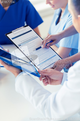 Image of close up of doctors with clipboard at hospital