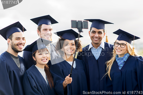 Image of students or bachelors taking selfie by smartphone