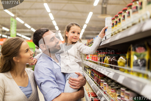 Image of happy family buying food at grocery store