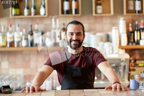 Image of happy man, barman or waiter at bar