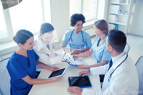Image of group of happy doctors meeting at hospital office