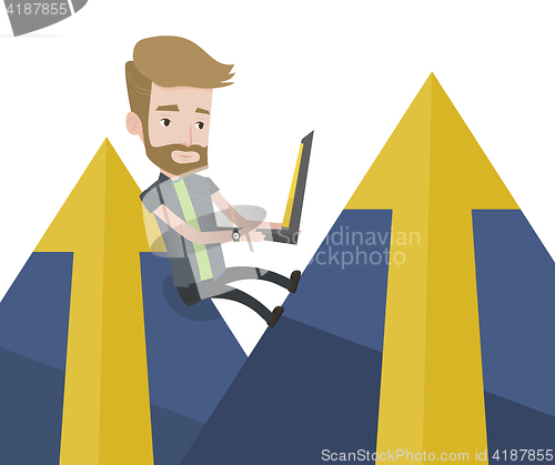 Image of Businessman working on laptop in the mountains.