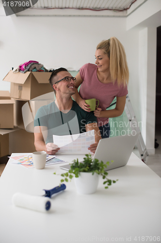 Image of Young couple moving in a new home