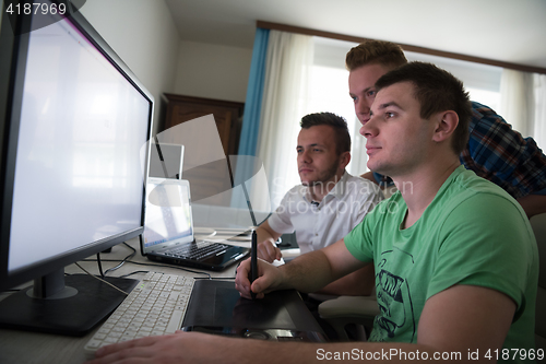 Image of a group of graphic designers at work