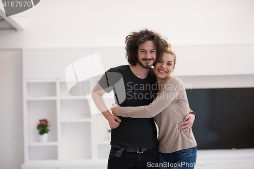 Image of couple hugging in their new home