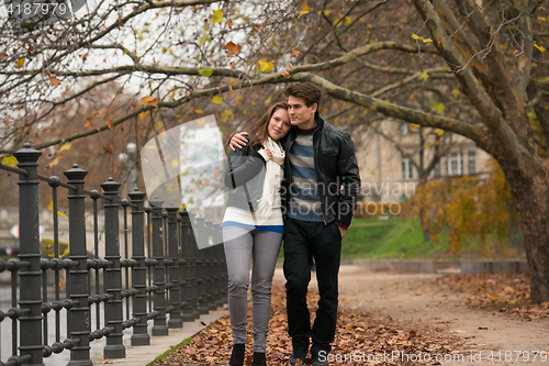 Image of Happy young Couple in Autumn Park