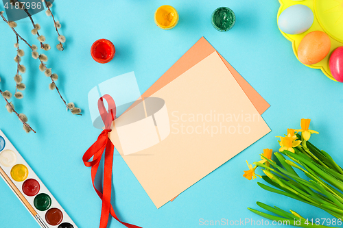 Image of The top view of easter on blue table office workplace