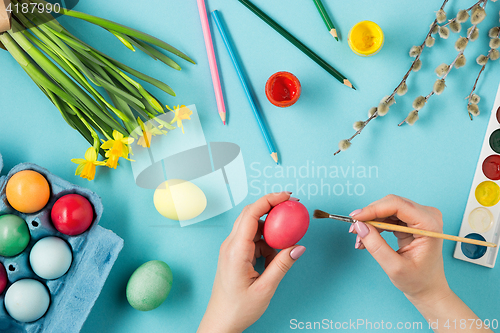 Image of The top view of easter on blue table office workplace