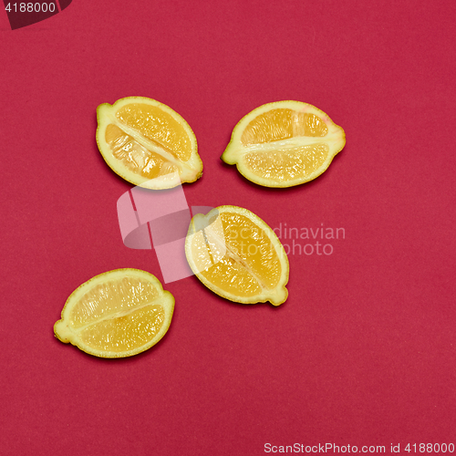 Image of Lemons on red background
