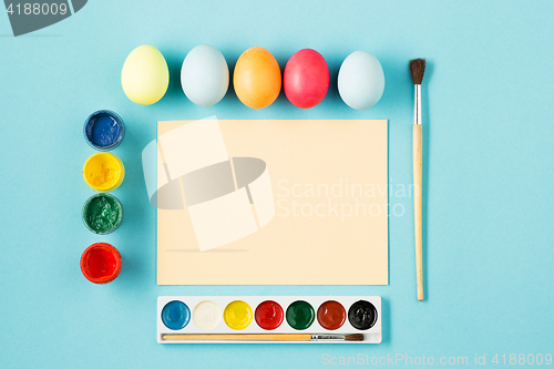 Image of The top view of easter on blue table office workplace