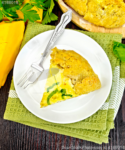 Image of Pie of pumpkin and cheese in plate on board top