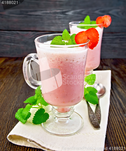 Image of Soup strawberry in goblet on dark board