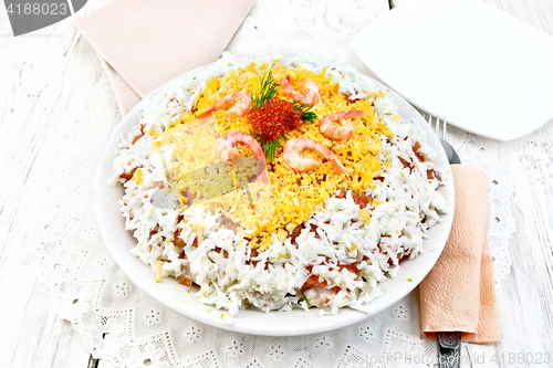 Image of Salad of salmon and seafood on light table