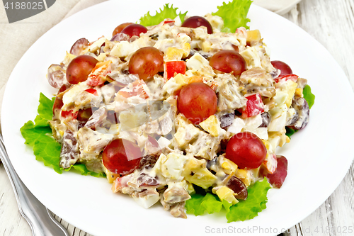 Image of Salad of meat and cheese with grapes