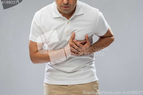 Image of close up of man suffering from heart ache