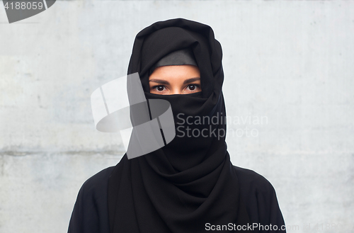 Image of muslim woman in hijab over gray background