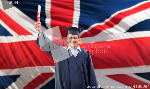 Image of happy male student with diploma over british flag 