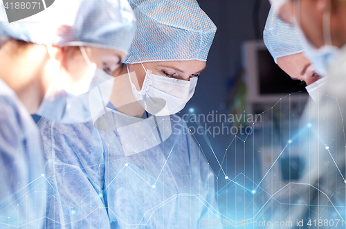 Image of group of surgeons in operating room at hospital