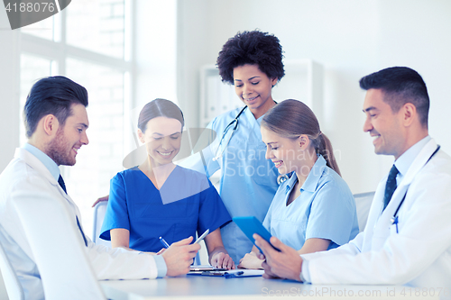 Image of group of happy doctors meeting at hospital office