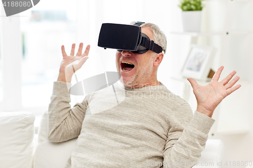 Image of old man in virtual reality headset or 3d glasses