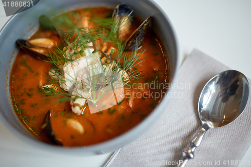 Image of close up of seafood soup with fish and mussels