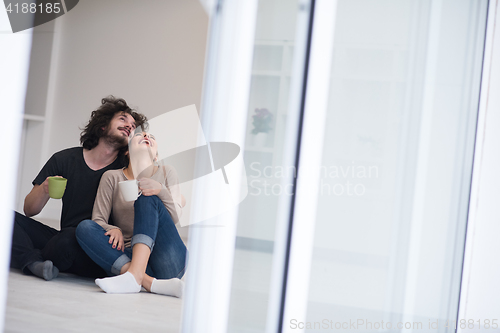 Image of young couple in their new home