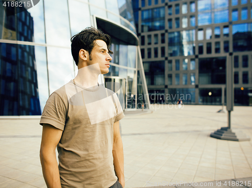 Image of young handsome man near business building, modern businessman concept