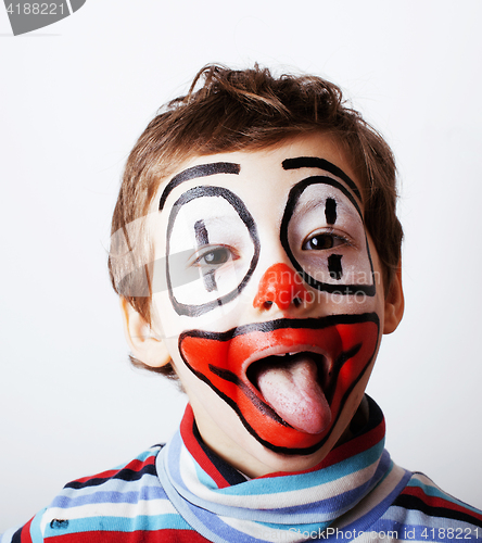 Image of little cute boy with facepaint like clown, pantomimic expression