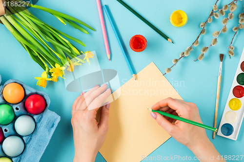 Image of The top view of easter on blue table office workplace